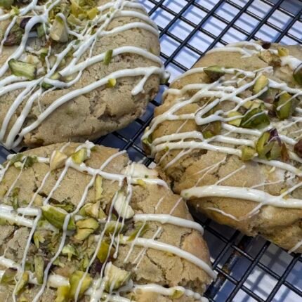 White chocolate & Pistachio Cookie drizzled with white chocolate and sprinkled with chopped pistachios