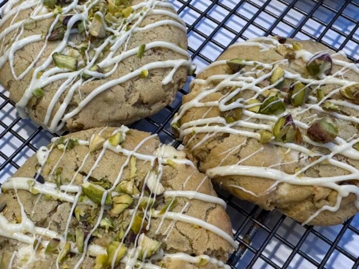 White chocolate & Pistachio Cookie drizzled with white chocolate and sprinkled with chopped pistachios